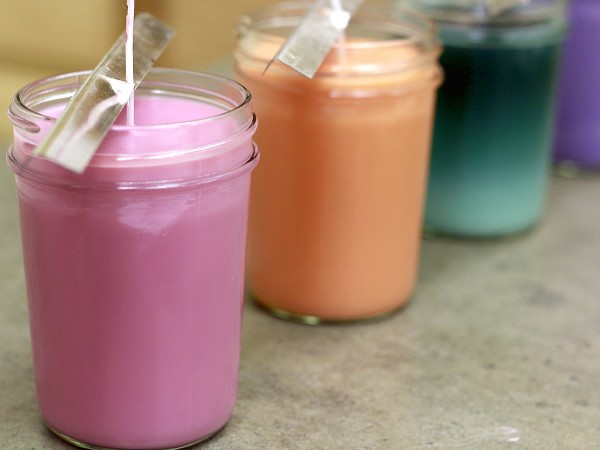 Premium Photo  Homemade candle making session using soy wax and assorted  glass containers photo shows a pair of hands using a thermometer to check  the temperature of soy wax